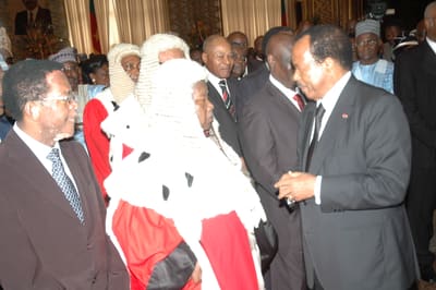 Dipanda Mouelle (middle) with President Paul Biya (right) in 2012